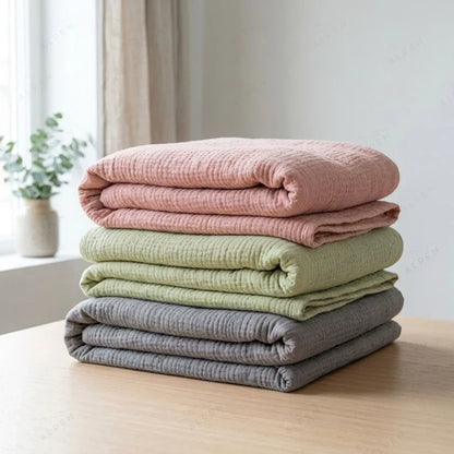 Mousselia™ – La couverture en mousseline de coton qui vous enveloppe de douceur