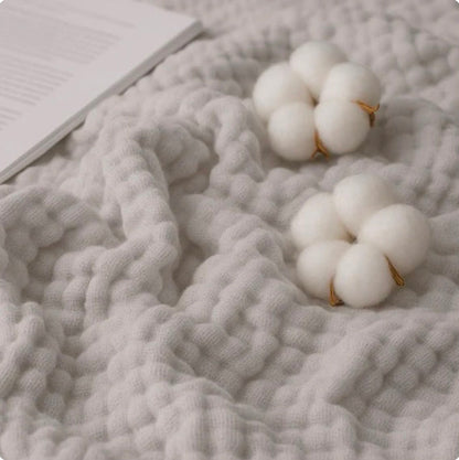 Mousselia™ – La couverture en mousseline de coton qui vous enveloppe de douceur